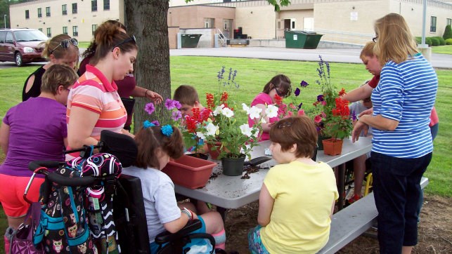 Teens In Transition Planting Flowers