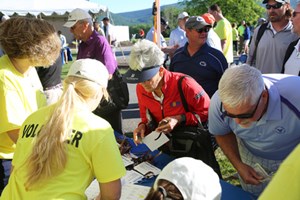 Volunteers helping golfers register